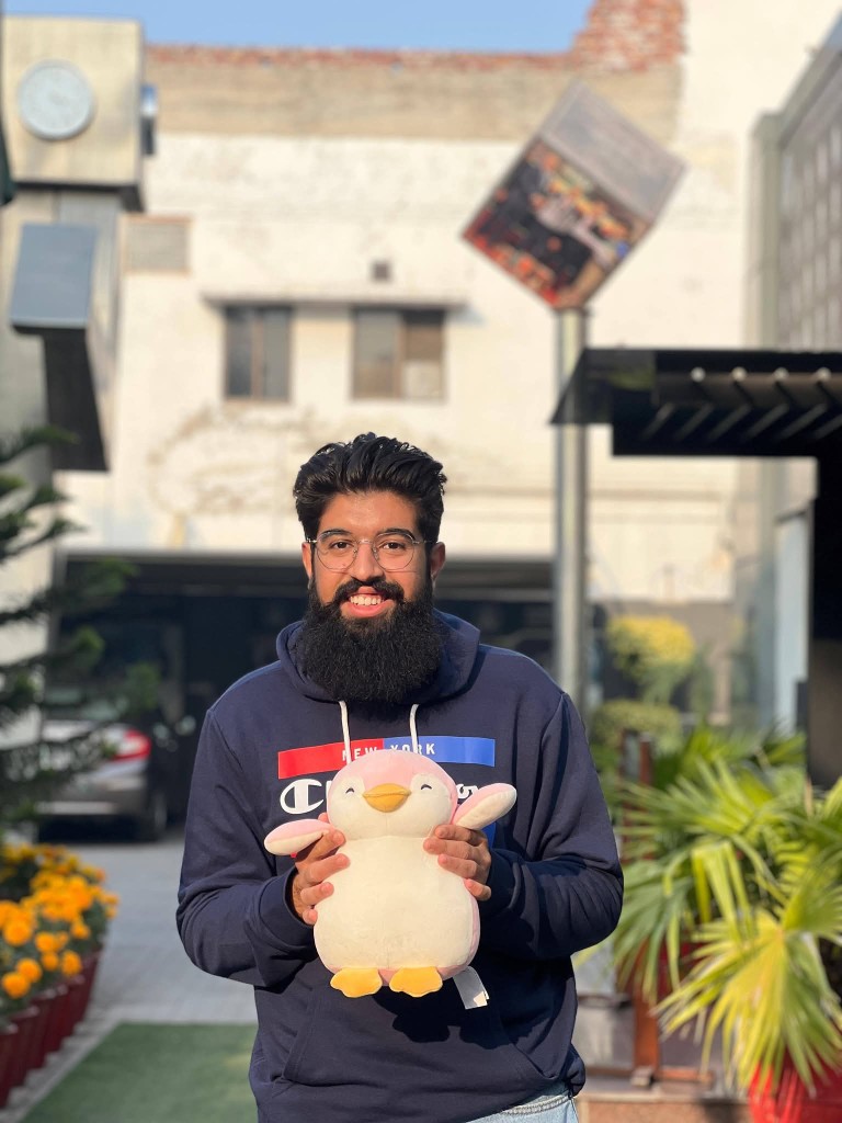 Theme Week 2026 student with plush toy